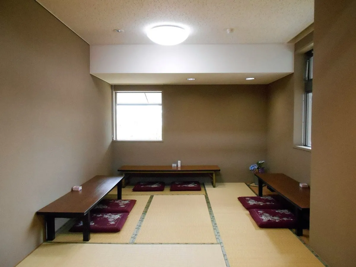 A traditional Japanese room floored with tatami mats laid edge to edge in a regular grid.